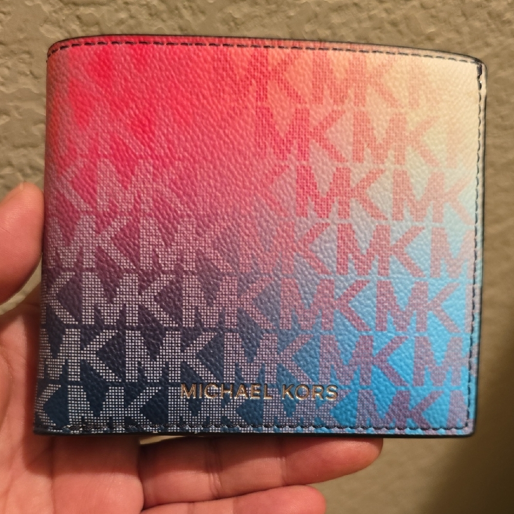 The product is a Michael Kors Cooper Ombré Signature Logo Billfold Wallet. 